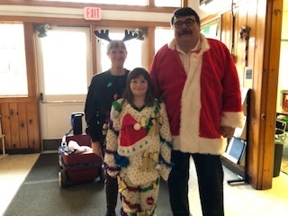 Santa and Rudolph visit with our most decked out student!